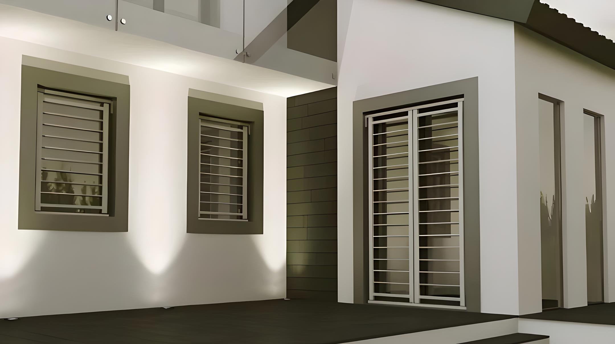 Facciata esterna di una casa con inferriate orizzontali in metallo su finestre e portafinestra, in stile contemporaneo con illuminazione notturna.
